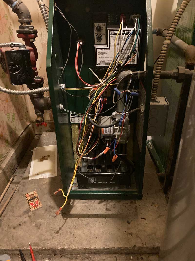 Boiler Repair technician servicing residential heating equipment near Des Plaines Illinois