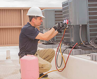 HVAC technician servicing residential heating and cooling equipment